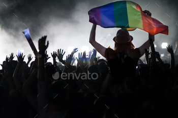 Homosexual parade with LGBT flag.