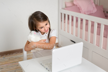 Girl making video name on pc, chatting with kids.