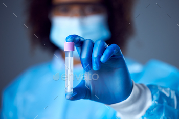 Female Lab Worker In PPE Keeping Check For Lateral Drift DNA PCR Check