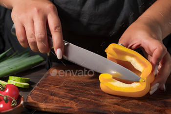 Cooking time. Shut-up describe of hands maintaining organic pepper