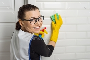 Portrait of cleansing service employee carrying protective rubber gloves,