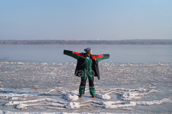 Marvelous girl taking part in iciness on a frozen lake