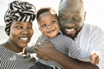 Entirely tickled African household having enjoyable on the beach for the interval of summer holidays – Dad and mom adore concep