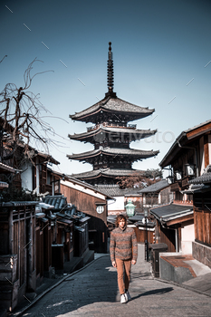 Man strolling on nineizaka dilapidated street in higashiyama-ku, kyoto,