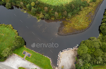 Drone aerial scenery of a river with boat moored on the river aspect. Keimeens Eire