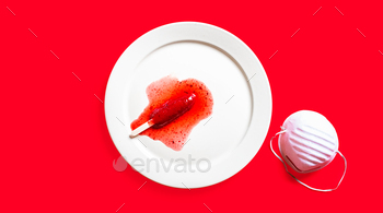 Scrumptious defrosted strawberry popsicles on white round dish and scientific conceal over pink background