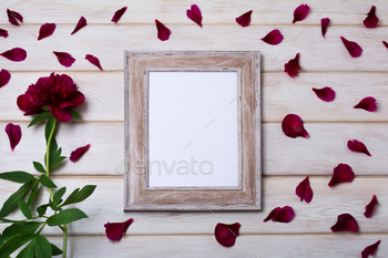 Wood image frame mockup with burgundy peony and petals