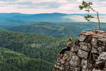 A traveler on the background of mountains