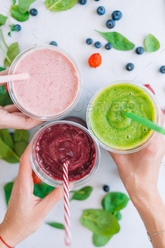 Row of wholesome contemporary fruit and vegetable smoothies with diverse substances