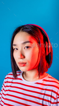 portrait younger asiatic lady isolated background listening music