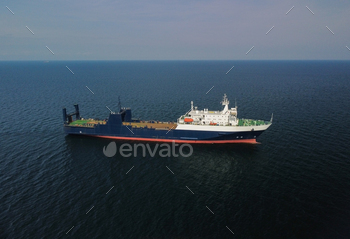 aerial watch ferry in the sea on a sunny day blue water