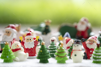 Santa Clause and chums sitting on white snow