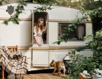 Tenting and travelling by camper van. Lady is ready for boulevard outing