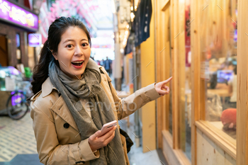 female pointing at wood eastern restaurant