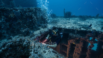 diver penetrating a sunken ship, technical diving