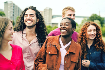 Diverse Ethnicities Laughing and Joking Collectively in a Metropolis Park