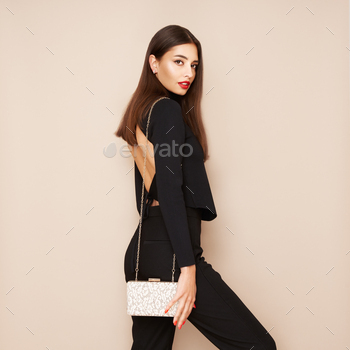 Younger girl posing in a murky tight suit