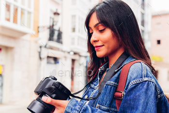 Scream girl with photo camera in town