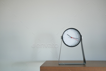 Round clock isolated on white background.