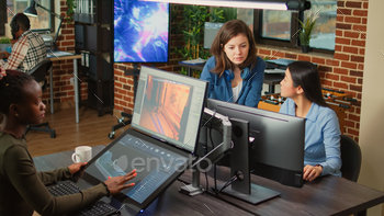 Creative other folks examining machine alternate utility on laptop