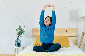 Young lady doing stretching exercises