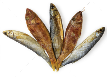 Dried fishes – Mullus and  Mugil – on the table. Salty dry  fish on a white background