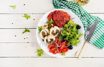 Chicken roll stuffed with mushrooms, beetroot fritters and fresh vegetable salad.