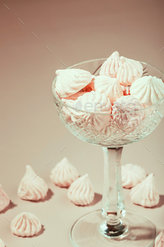 Crimson meringue cookies in a crystal vase