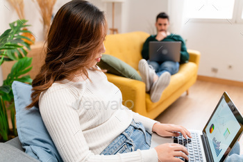 Pleased couple the usage of pc computer at dwelling