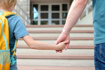 Cramped schoolboy with his father goes to faculty after summer time holiday.