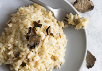 Risotto with porcini mushrooms and dusky truffles served in a plate high place confidence in, gourmet cousine