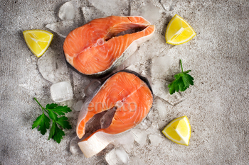 Contemporary salmon fish. Raw salmon steaks on ice. Food background. To