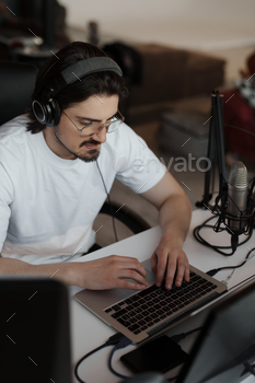 Targeted man working in recording studio