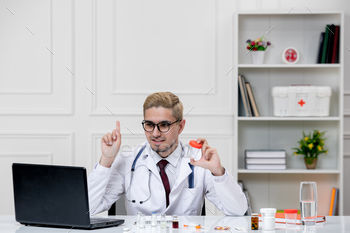 clinical gentle dapper aesthetic doctor man in lab coat in health center with stethoscope smiling