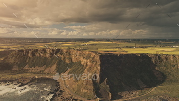 Sun ocean flee aerial. Nobody nature landscape countryside. Cliff grass valley. Rural field, farm