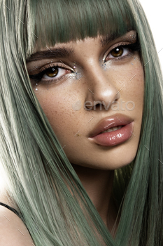 Beauty Fashion Model Woman with Colourful Dyed Hair. Woman with ideal Make-up and Coiffure. Model