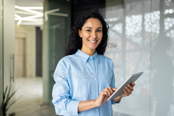 Young and qualified feminine programmer, portrait of feminine engineer with tablet laptop startup