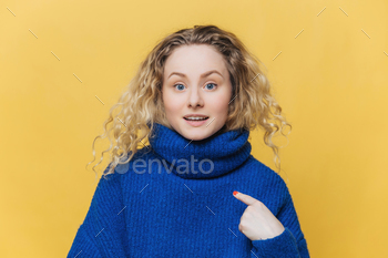 Bowled over female mannequin with curly hair facets to empty dwelling on her current winter sweater