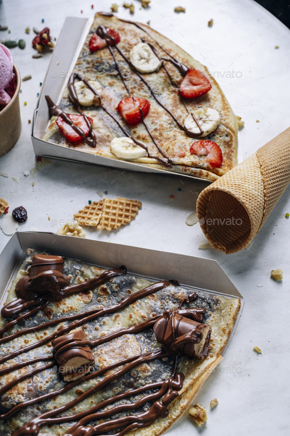 Candy chocolate crepes on the table. Vertical picture