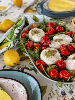 Burrata with tomatoes on arugula