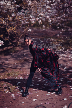 Shining younger girl wearing kimono with cherry blossoms, sakura peek