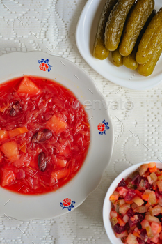 Ukrainian conventional dishes. Lean borscht, French dressing, pickled cucumbers