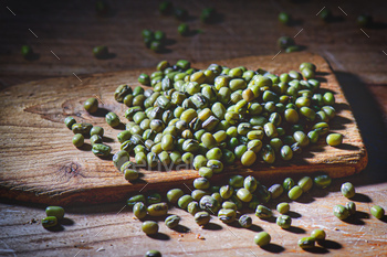 Inexperienced beans seed on picket pallet