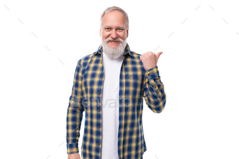 senior pensioner gray-haired man with a beard in a shirt reveals his index finger to the facet on a