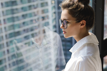 Young businesswoman in her establish of job in the fashioned building of monumental city