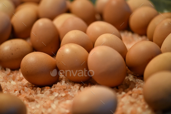 Fresh local brown boiled eggs on a mattress of pink Himalayan salt