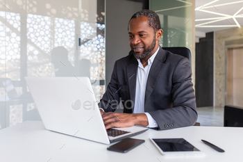 A hit vulnerable african american businessman at work inside field of enterprise, skilled boss working with