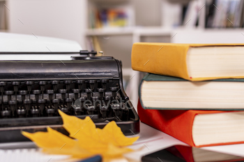 Writer’s place of residing of job: retro typewriter, lot of books, pocket ebook and pens, up to date mobile phone. Inventive