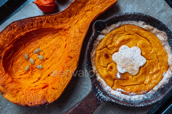 Homemade pumpkin pie in solid iron skillet