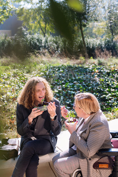 man and girl drinking a salad on a break from work